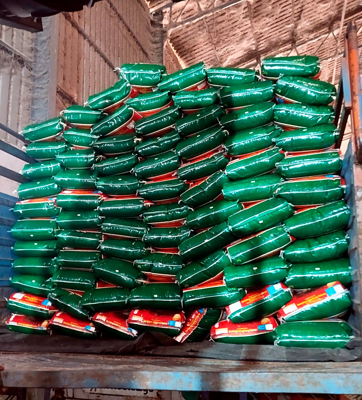 Packed rice bags loaded onto lorry for dispatch